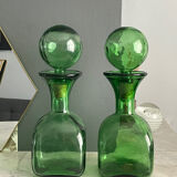 Two green glass decanters