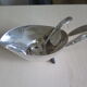 Angora tripod and silver metal spoon
