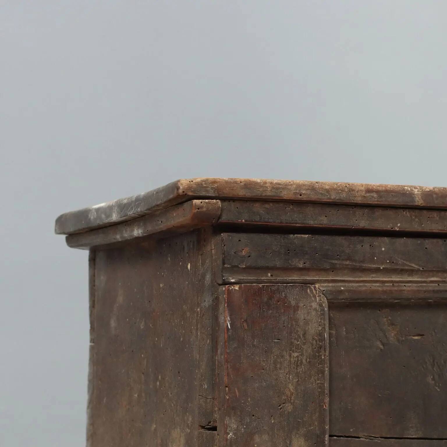 Antique walnut chest with a hinged lid, Italy, 17th century.