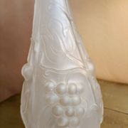 Frosted transparent glass carafe with raised cherry and grape patterns.