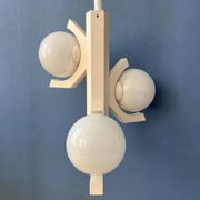 Mid-century white suspension with a bony design and opaline glass shade.