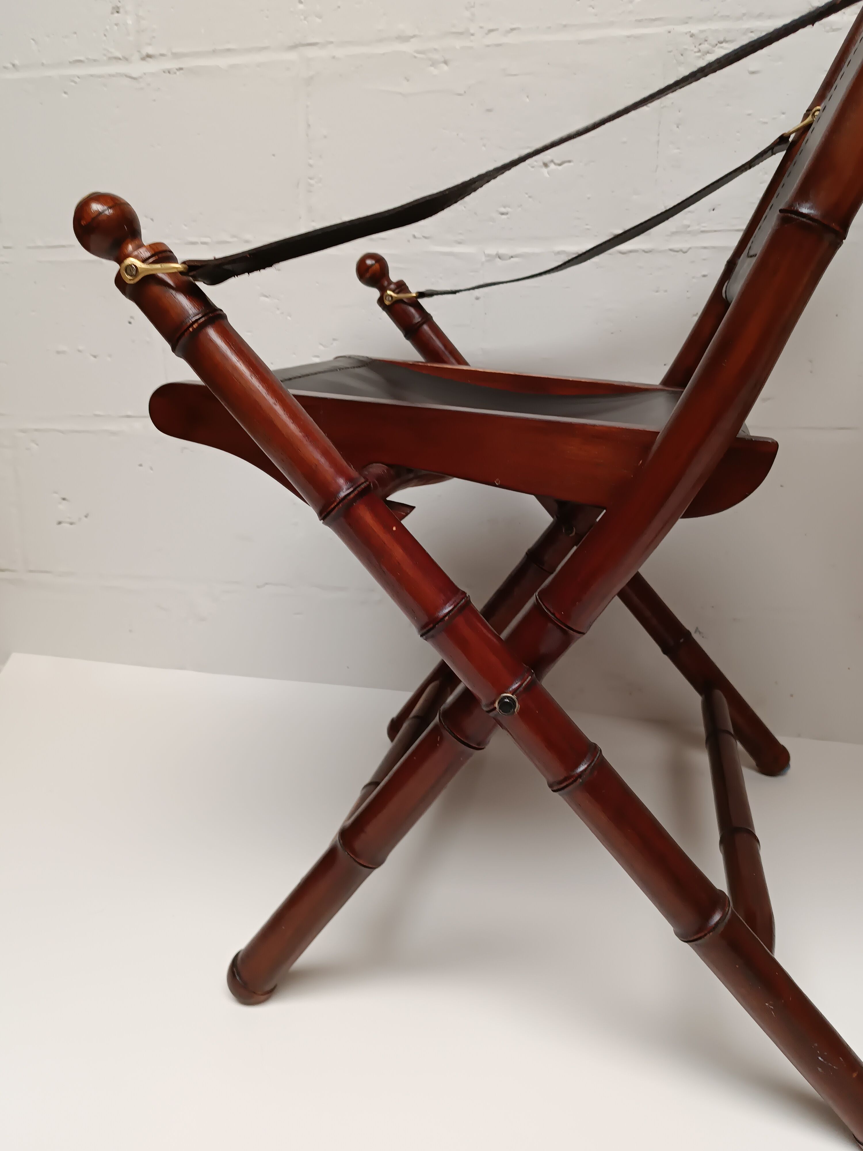 Pair of vintage "safari" folding armchairs in mahogany and leather