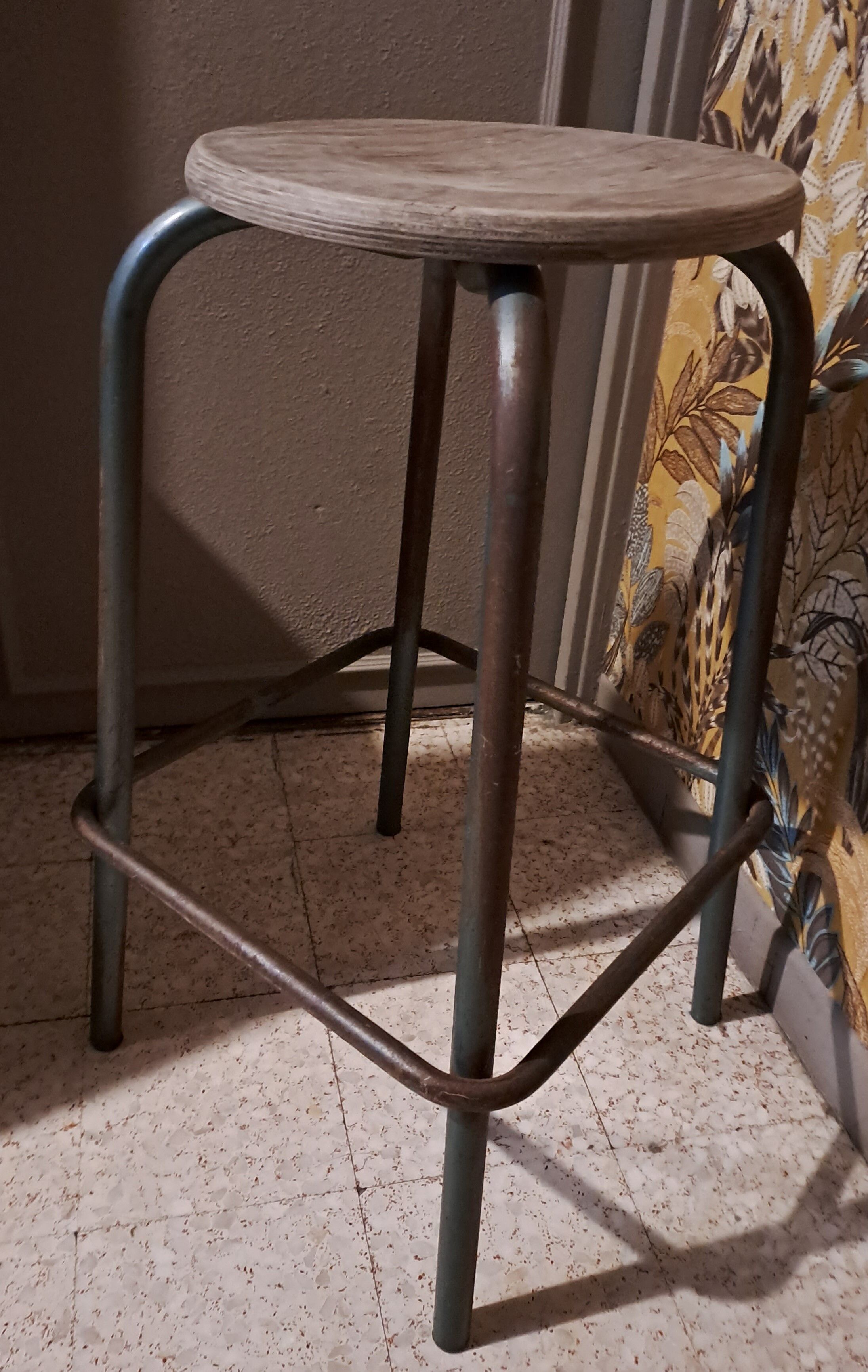 High metal stool and wooden seat Labo style dating from the 1940s industrial style