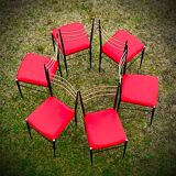 Six steel and brass chairs attributed to Carlo de Carli