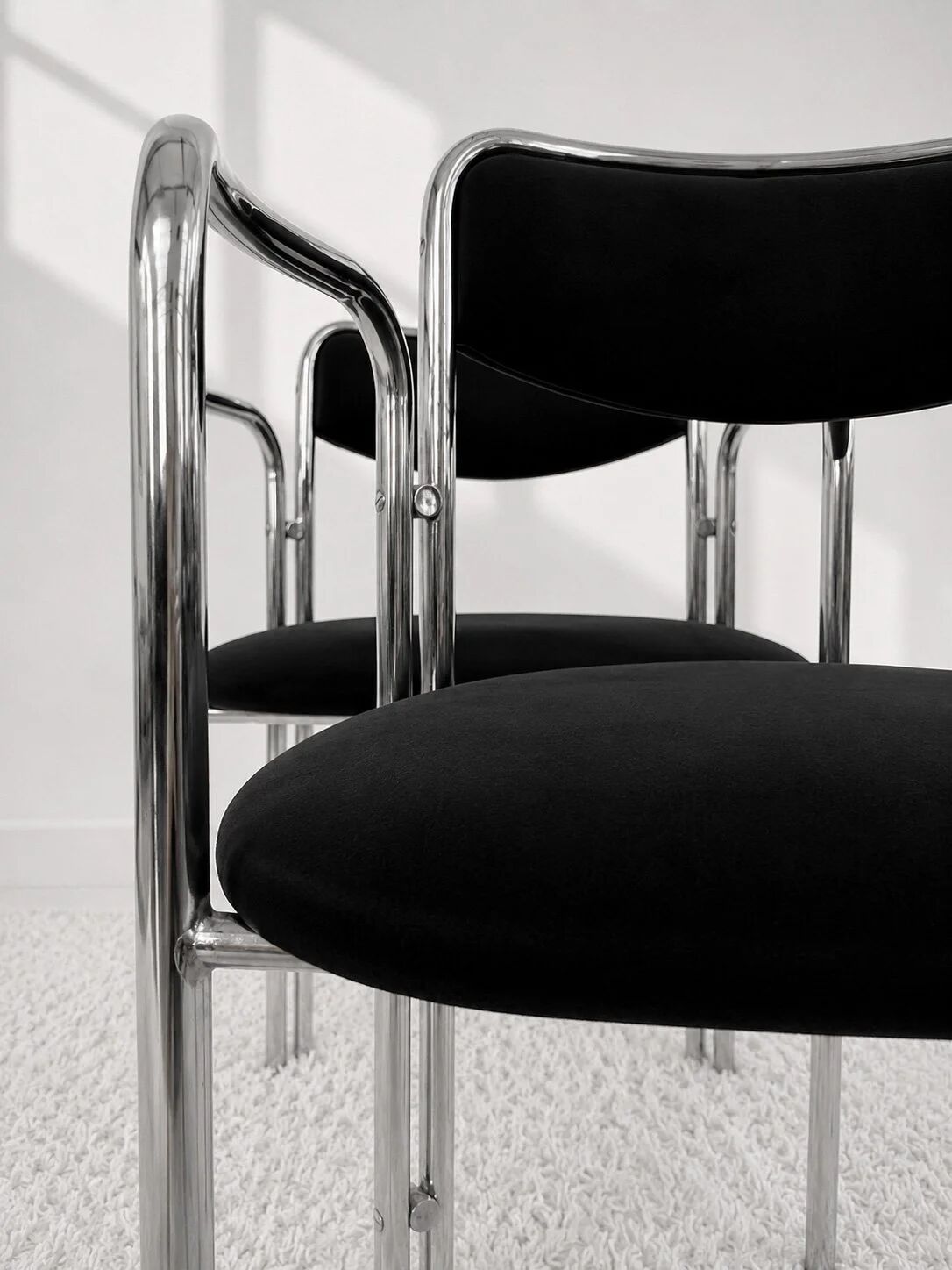 Vintage chairs with double chrome structure and black velvet. 70s