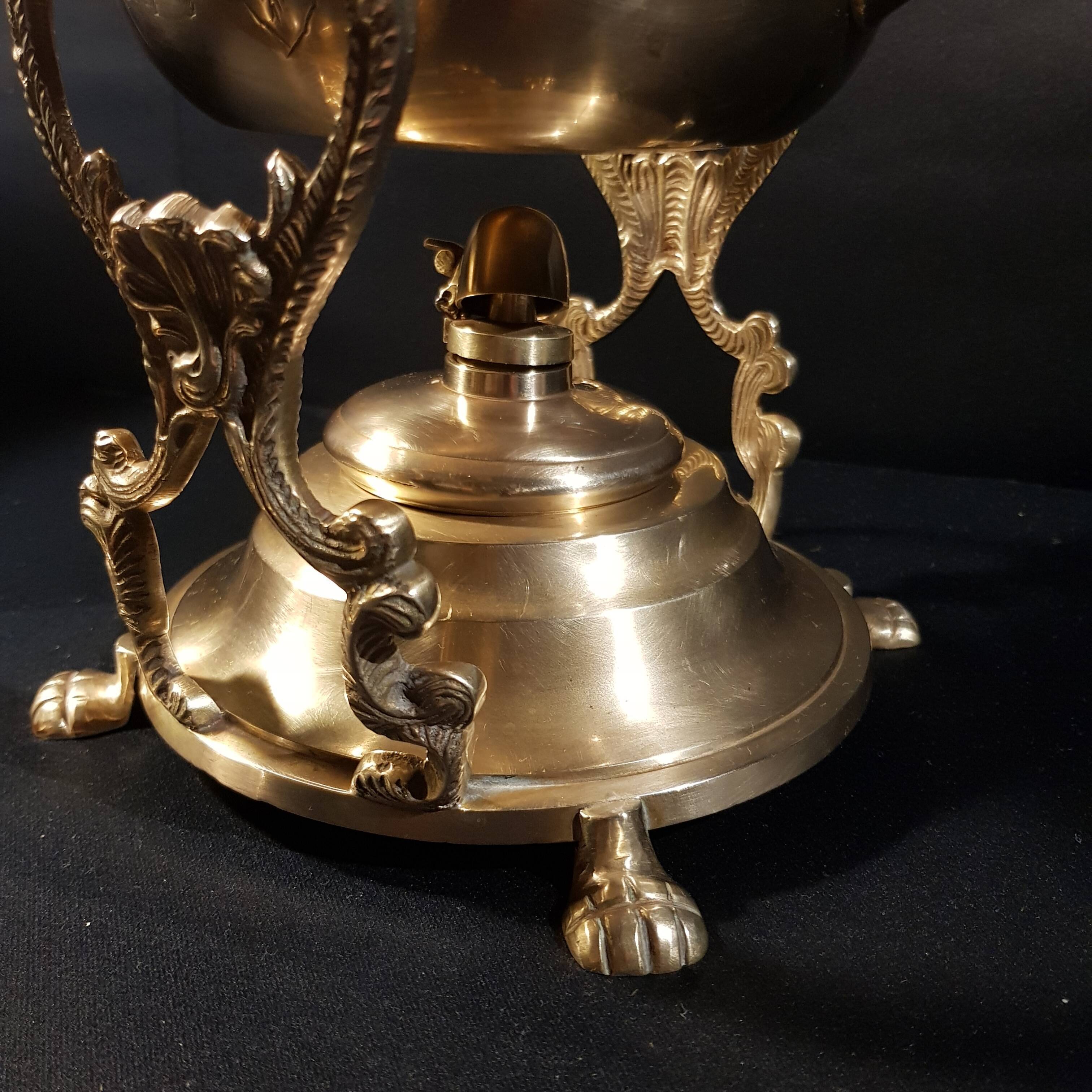 Oriental teapot on its support