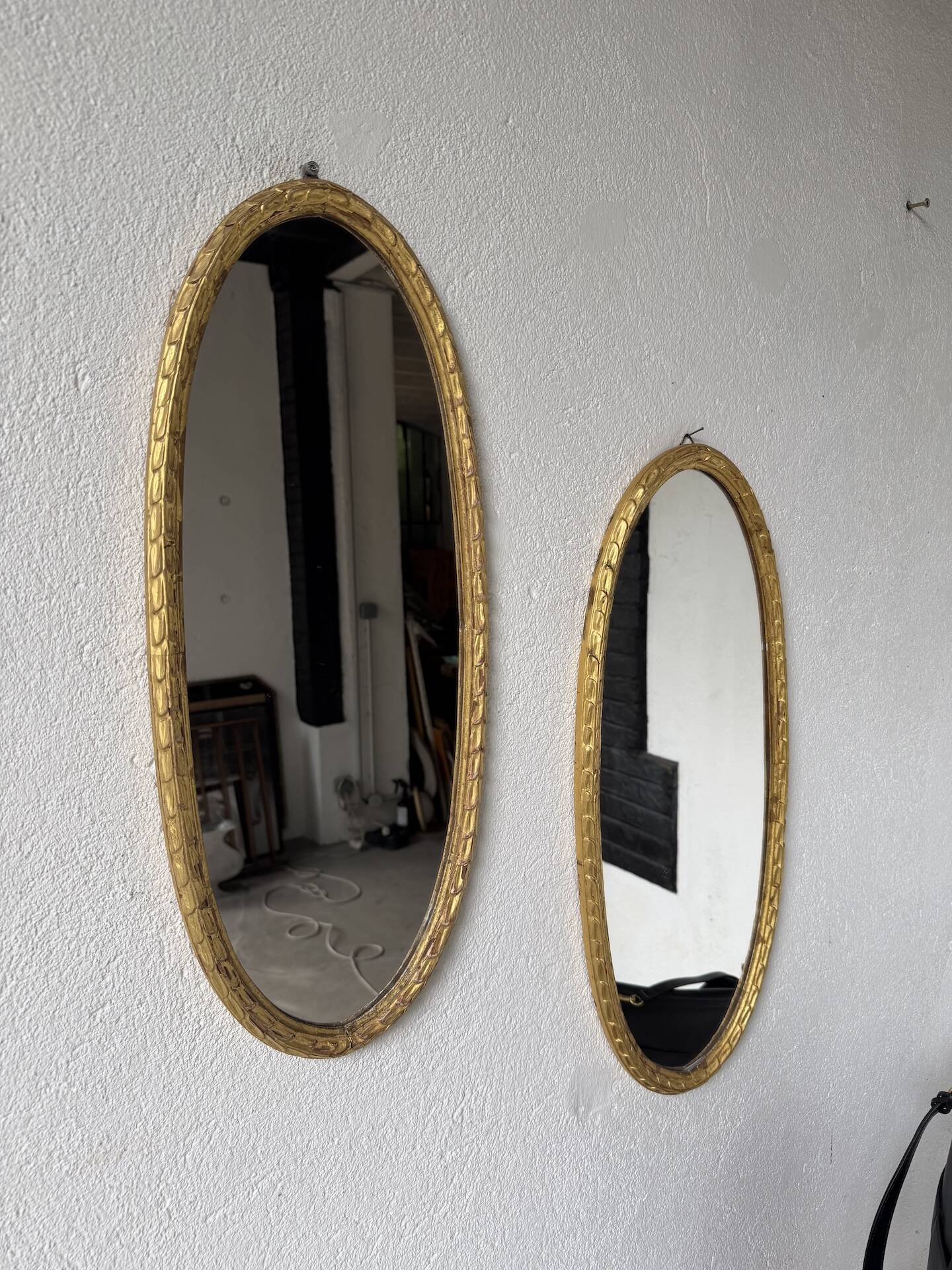 Pair of oval mirrors 1900 gilded stucco