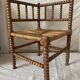 Corner chair in straw and turned wood, fireside chair.