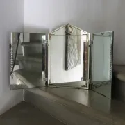 Triptych mirror with eglomisé and pediment, 1940s-50s