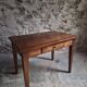 Old French table in cherry wood with bistro chair, circa 1900–1930.