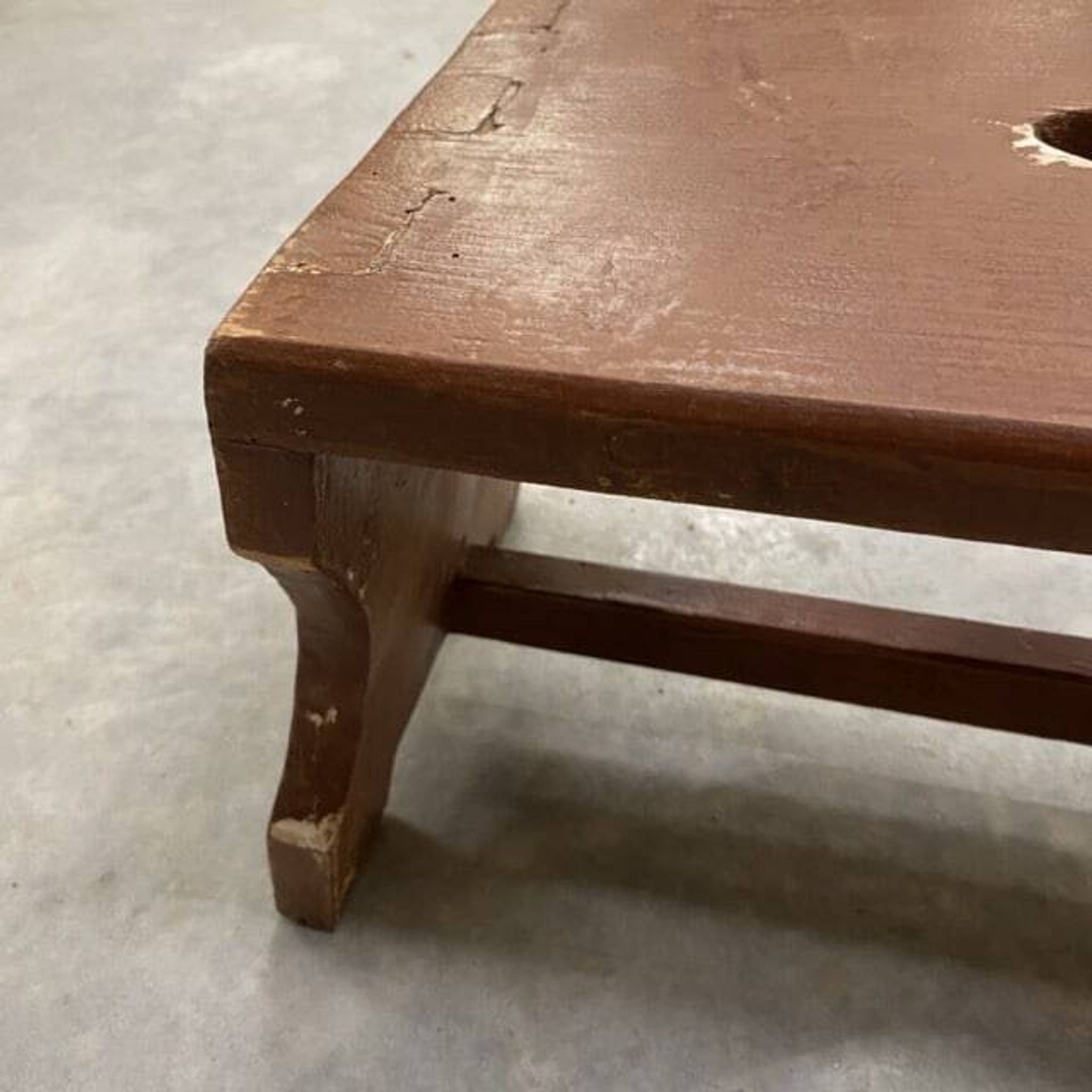 Small stool or Hungarian bench in wine red.