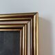 Photo frame under glass, gilded wood