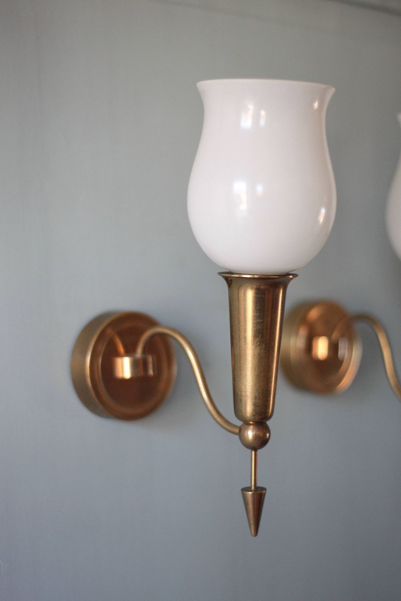 Pair of gold metal and white opaline wall sconces, wall light, sconce.