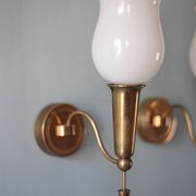 Pair of gold metal and white opaline wall sconces, wall light, sconce.