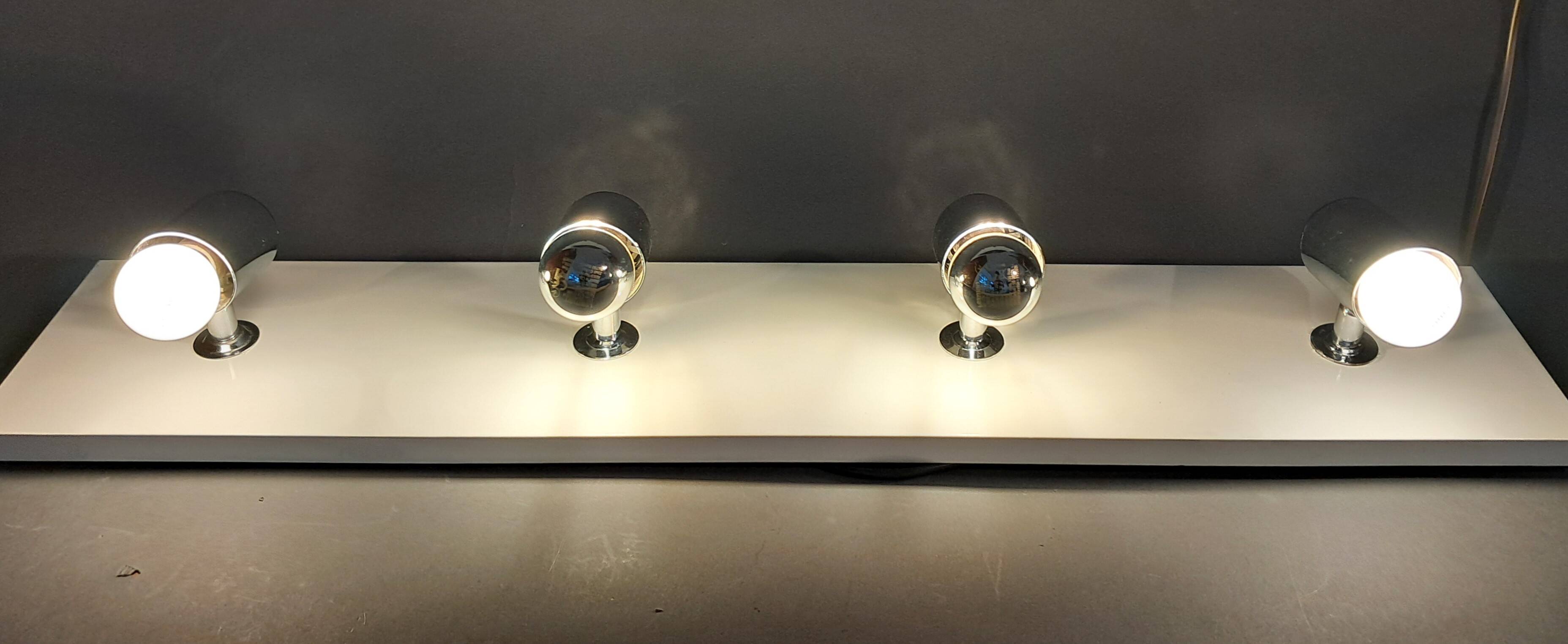 Targetti Sankey spotlights on white lacquered wooden ramp