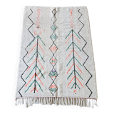 White wool Berber rug with fluorescent orange green patterns