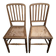 Set of 2 antique wooden chairs with caned seats.