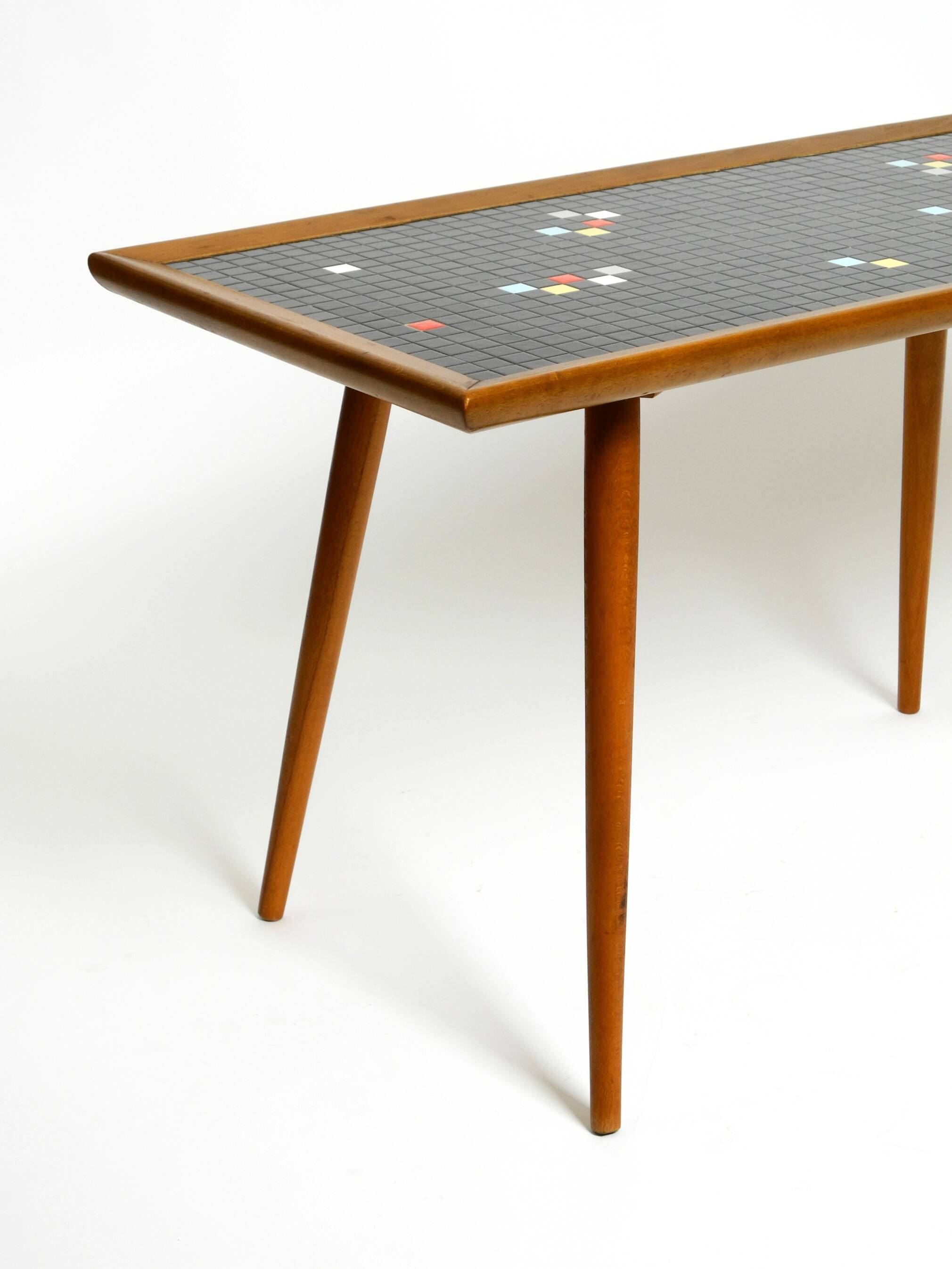 Beautiful long Mid Century walnut wood coffee table with a mosaic surface