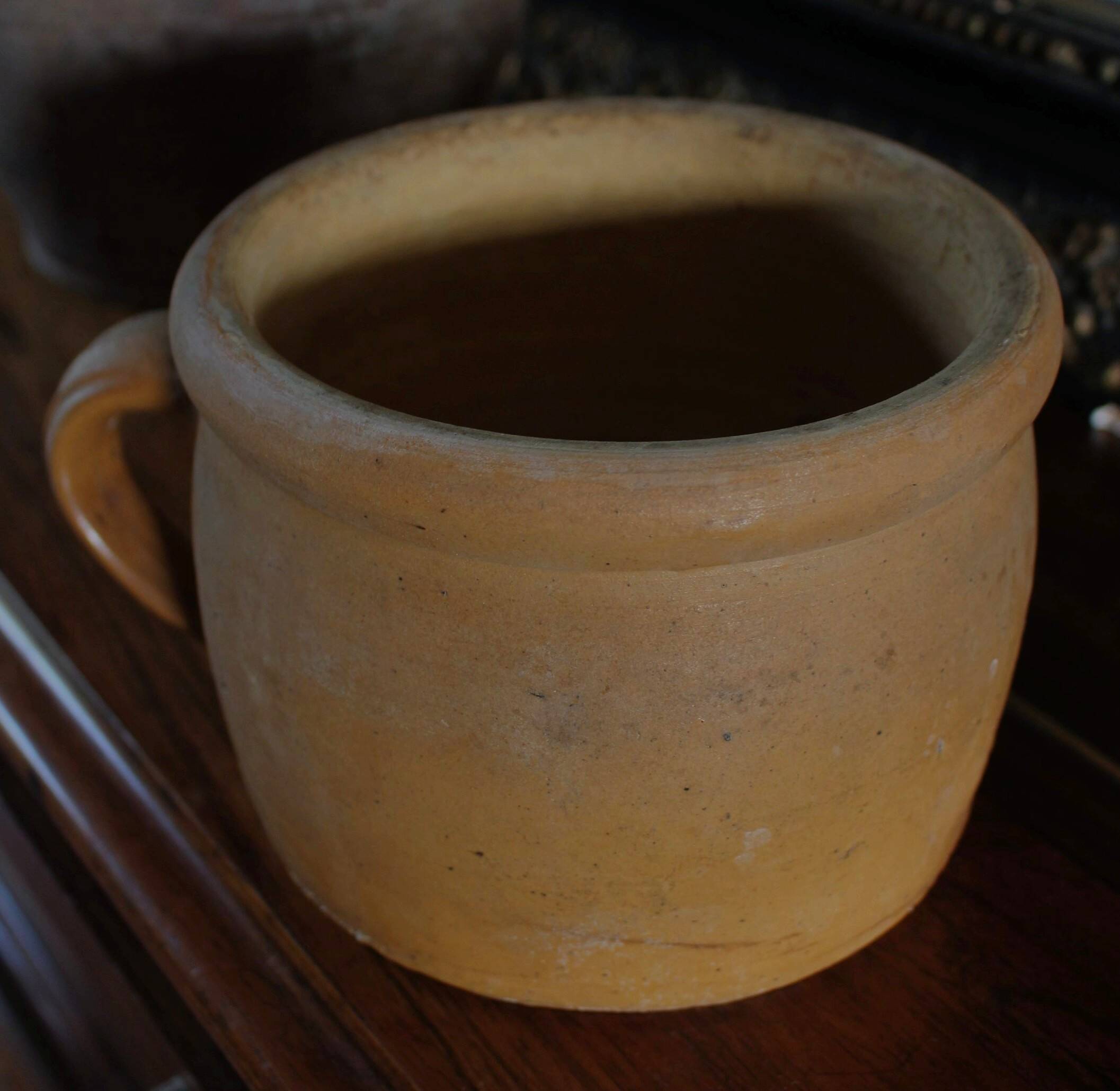 Round terracotta milk jug with handle
