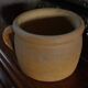 Round terracotta milk jug with handle