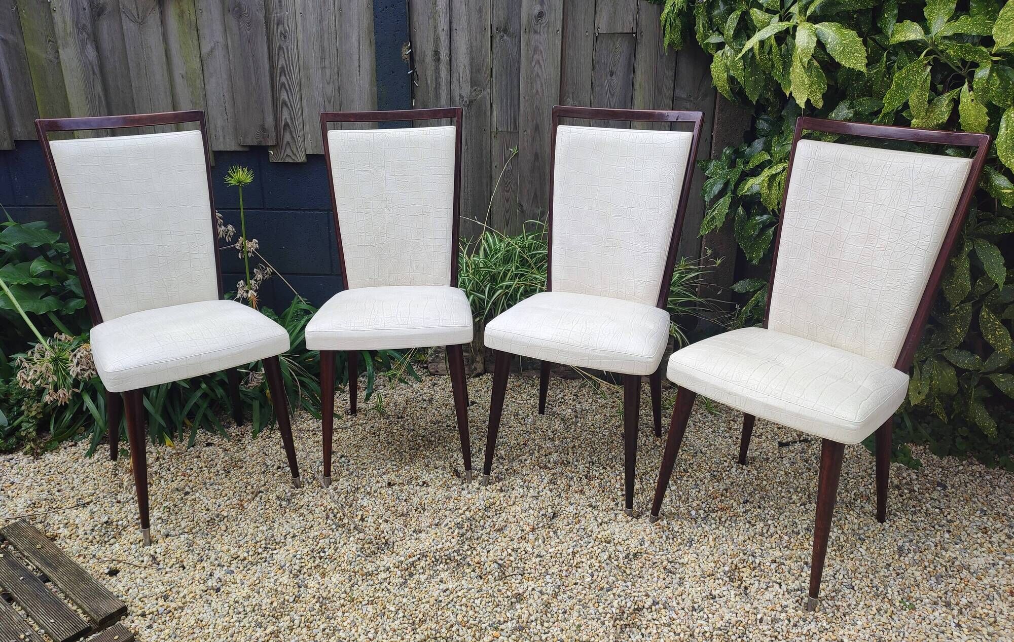 Set of 4 Vintage Mid-Century Modern Chairs with tapered metal legs.