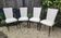 Set of 4 Vintage Mid-Century Modern Chairs with tapered metal legs.