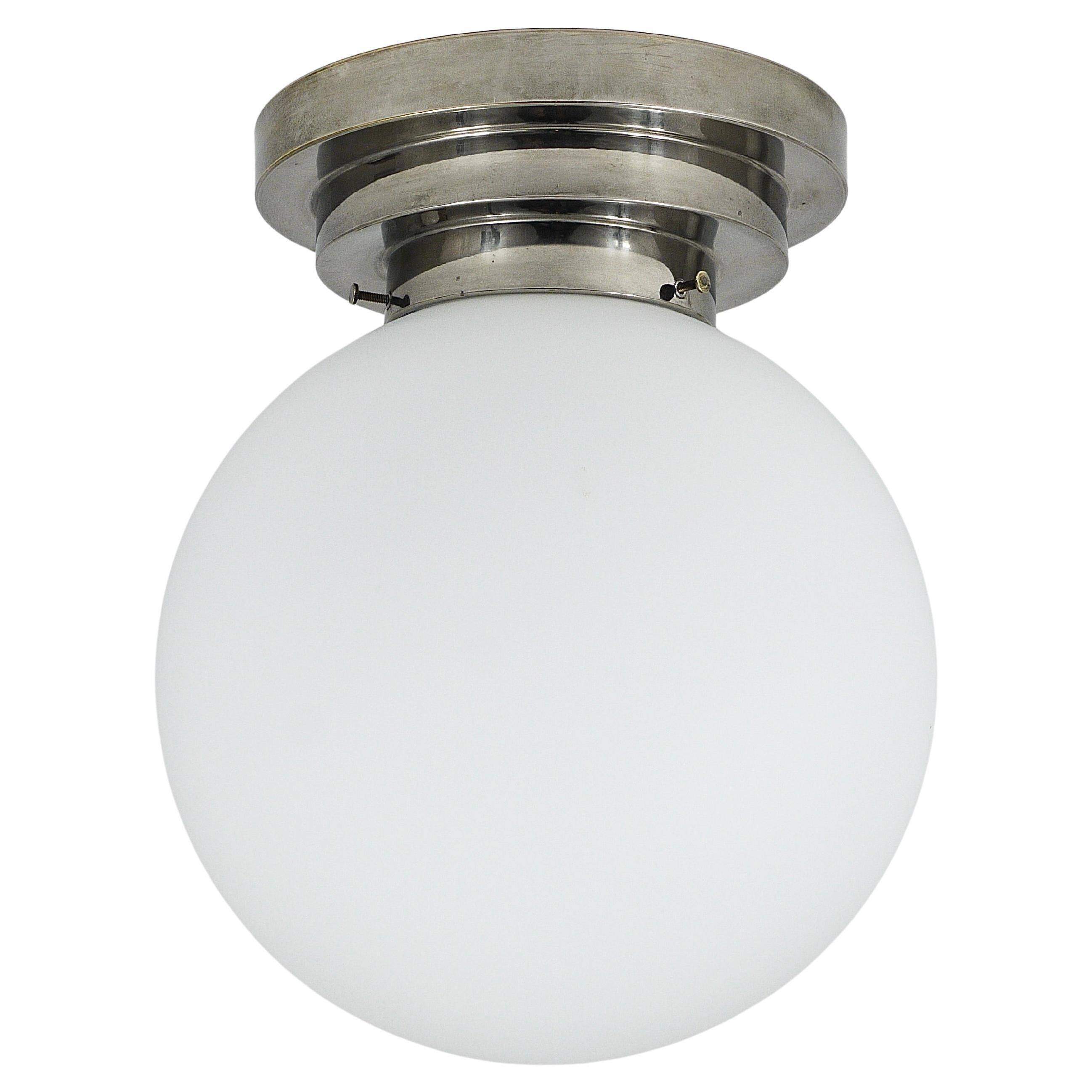 Large opaline glass globe ceiling lamp in Art Deco style.