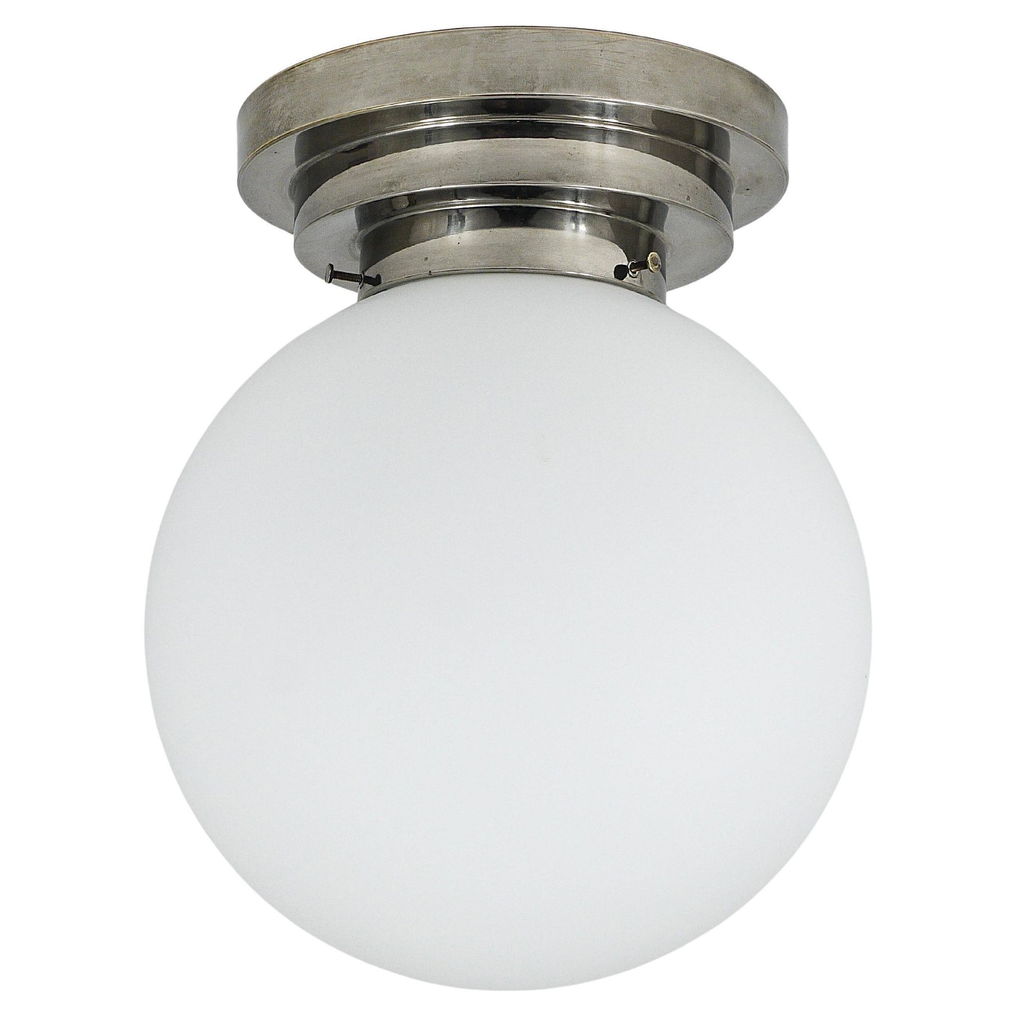 Large opaline glass globe ceiling lamp in Art Deco style.