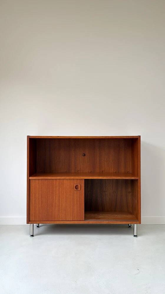 Vintage wooden cabinet with sliding doors