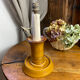 Candle holder-style lamp made entirely of ceramic.