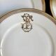 6 flat plates in gold porcelain monogrammed "F"