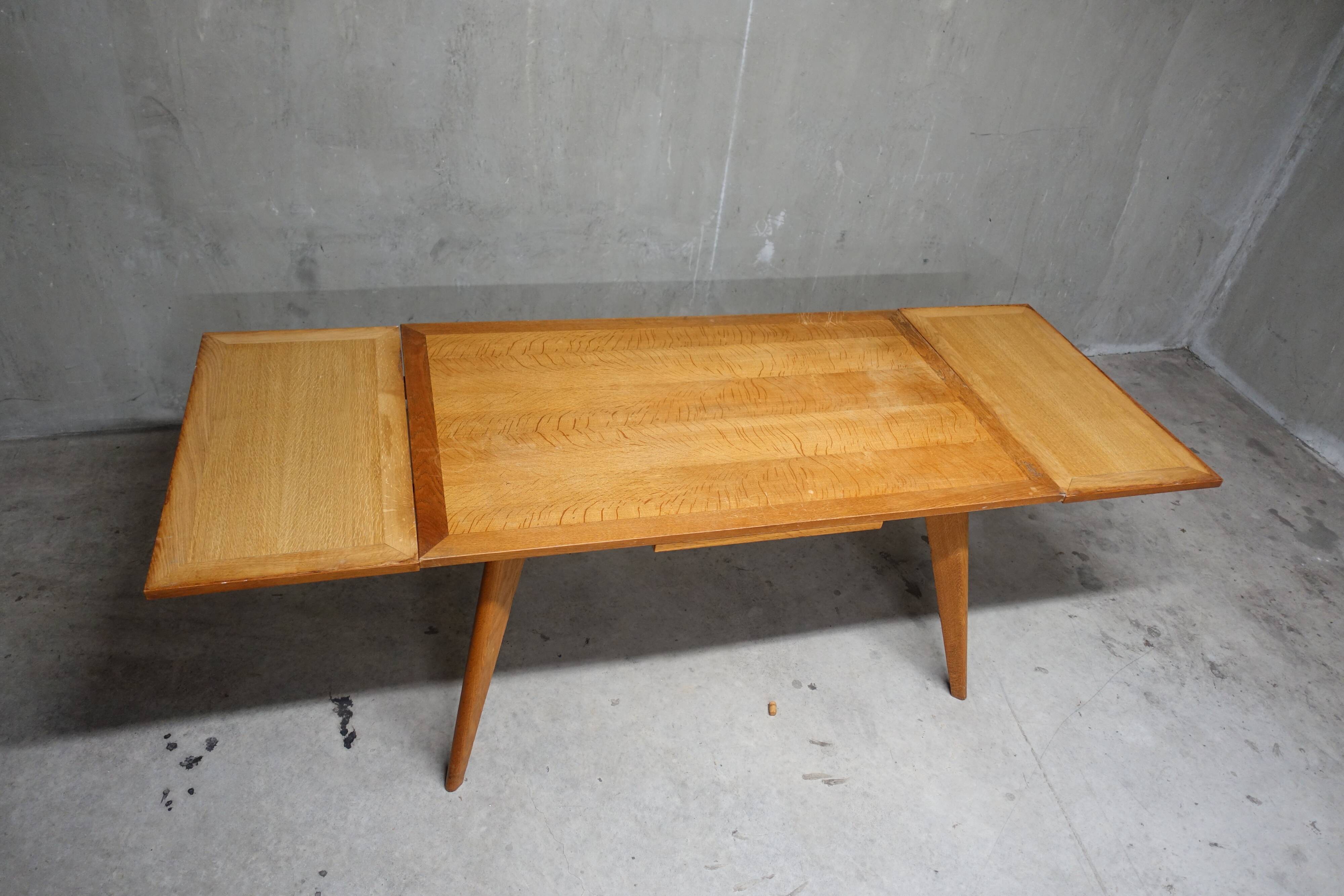 Dining table in blond oak compass feet 1950