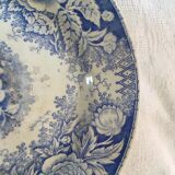 Together seven dessert plates mismatched in blue.
