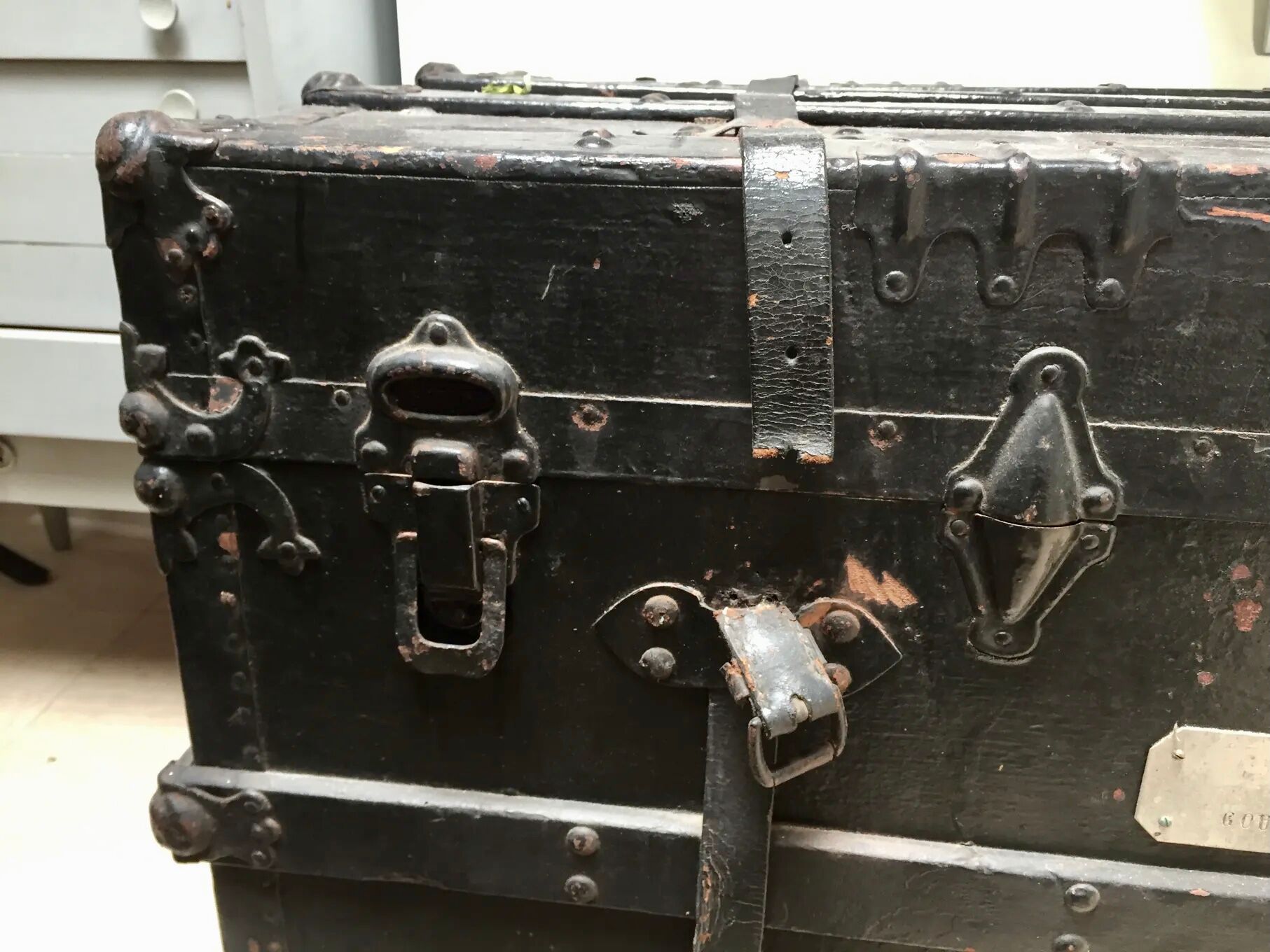 Black ancient travel trunk, 19th