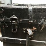 Black ancient travel trunk, 19th