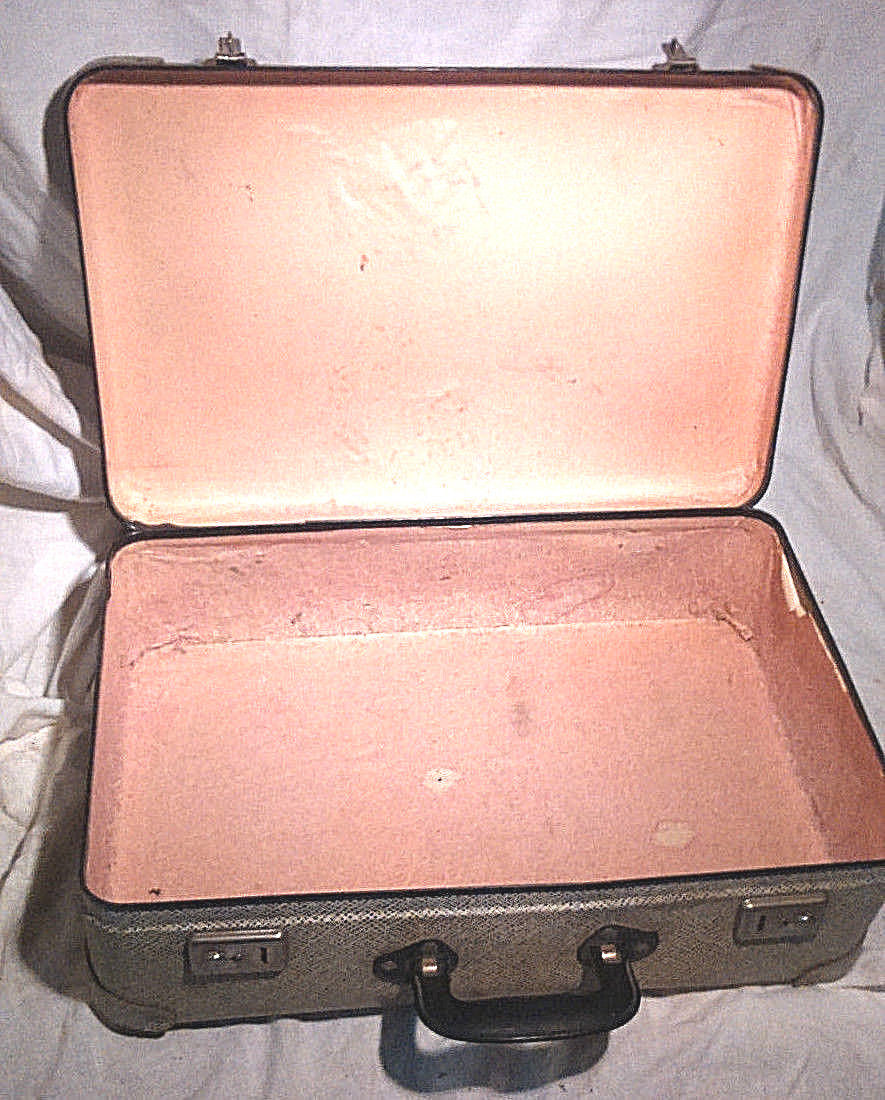 Old vintage black and white cardboard storage suitcase travel