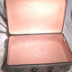 Old vintage black and white cardboard storage suitcase travel