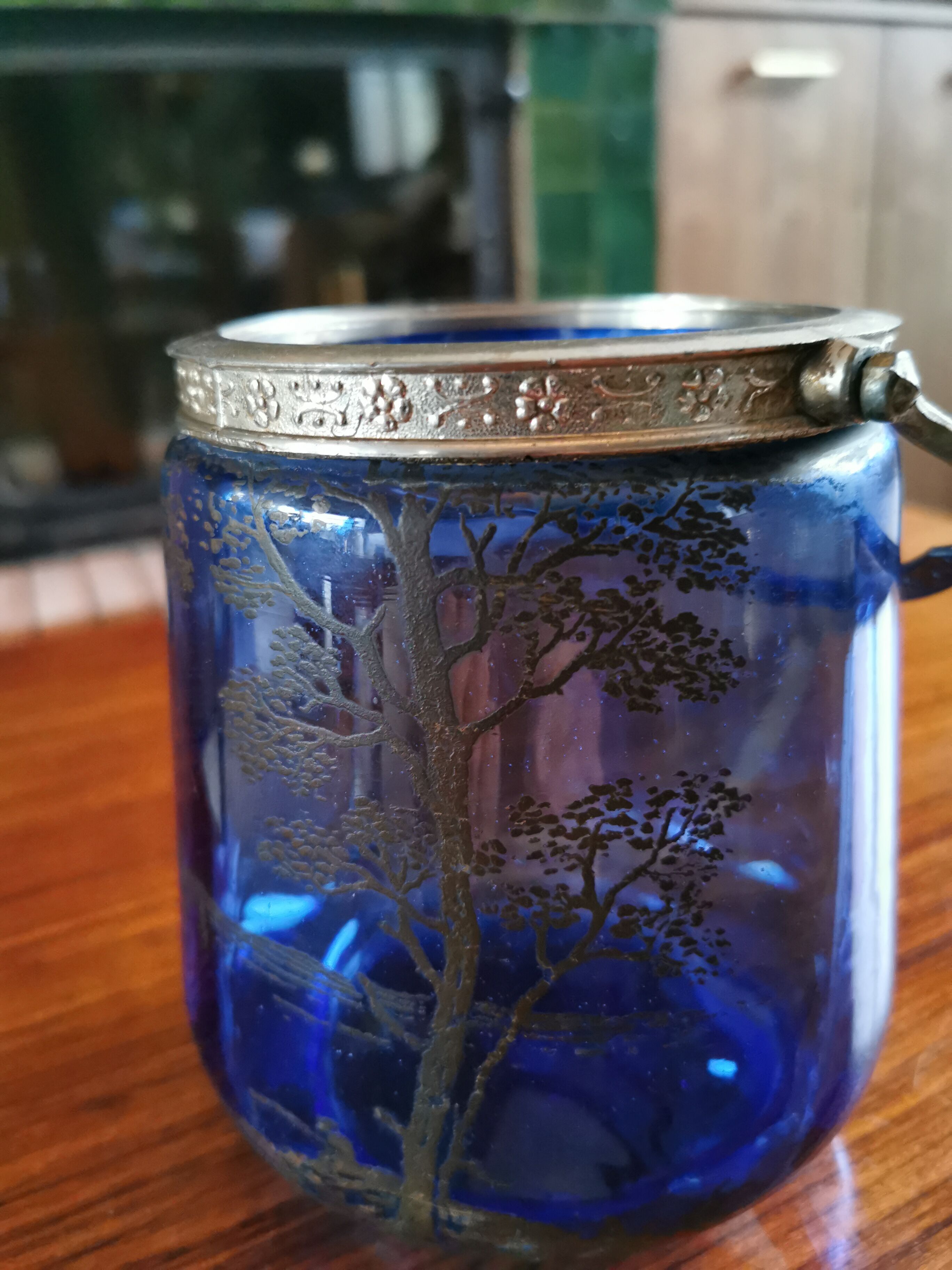 Old ice or biscuit bucket made of golden decor blue glass