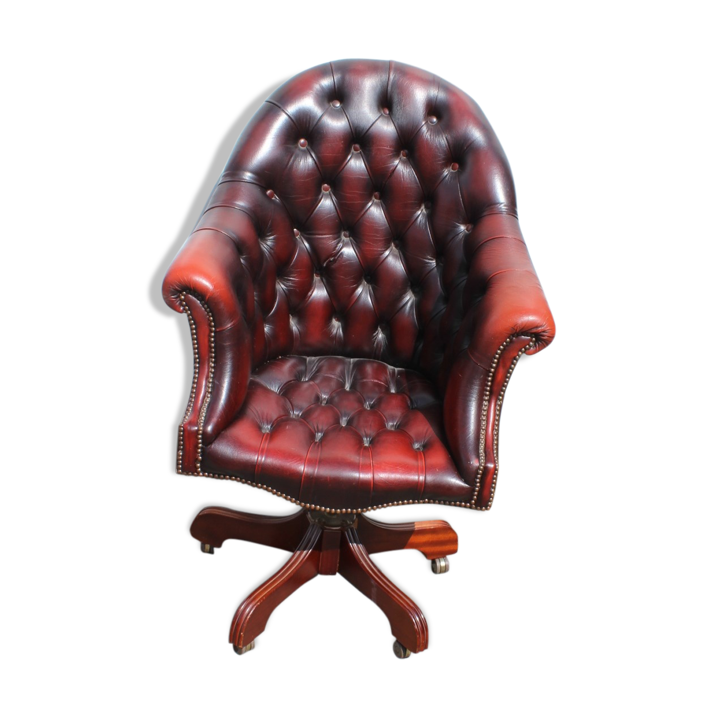 Oxblood leather bucket chair revolving