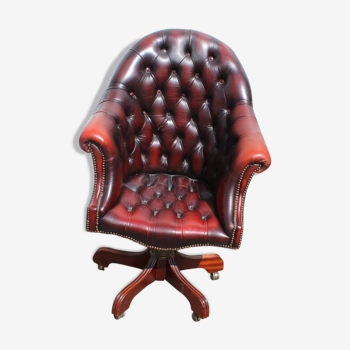 Oxblood leather bucket chair revolving