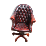 Oxblood leather bucket chair revolving