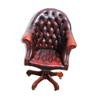 Oxblood leather bucket chair revolving