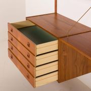 Danish teak wall unit in the style of Cadovius, Sorensen with a lamp, 1970s