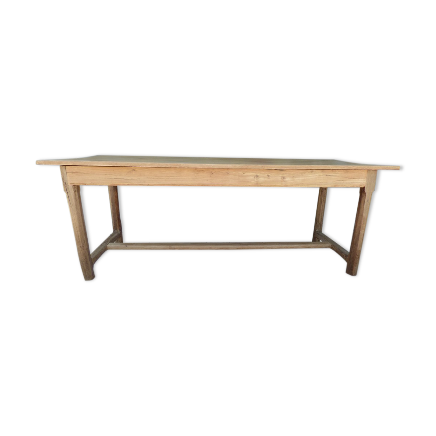 Large honey-colored farmhouse table in solid oak