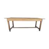 Large honey-colored farmhouse table in solid oak