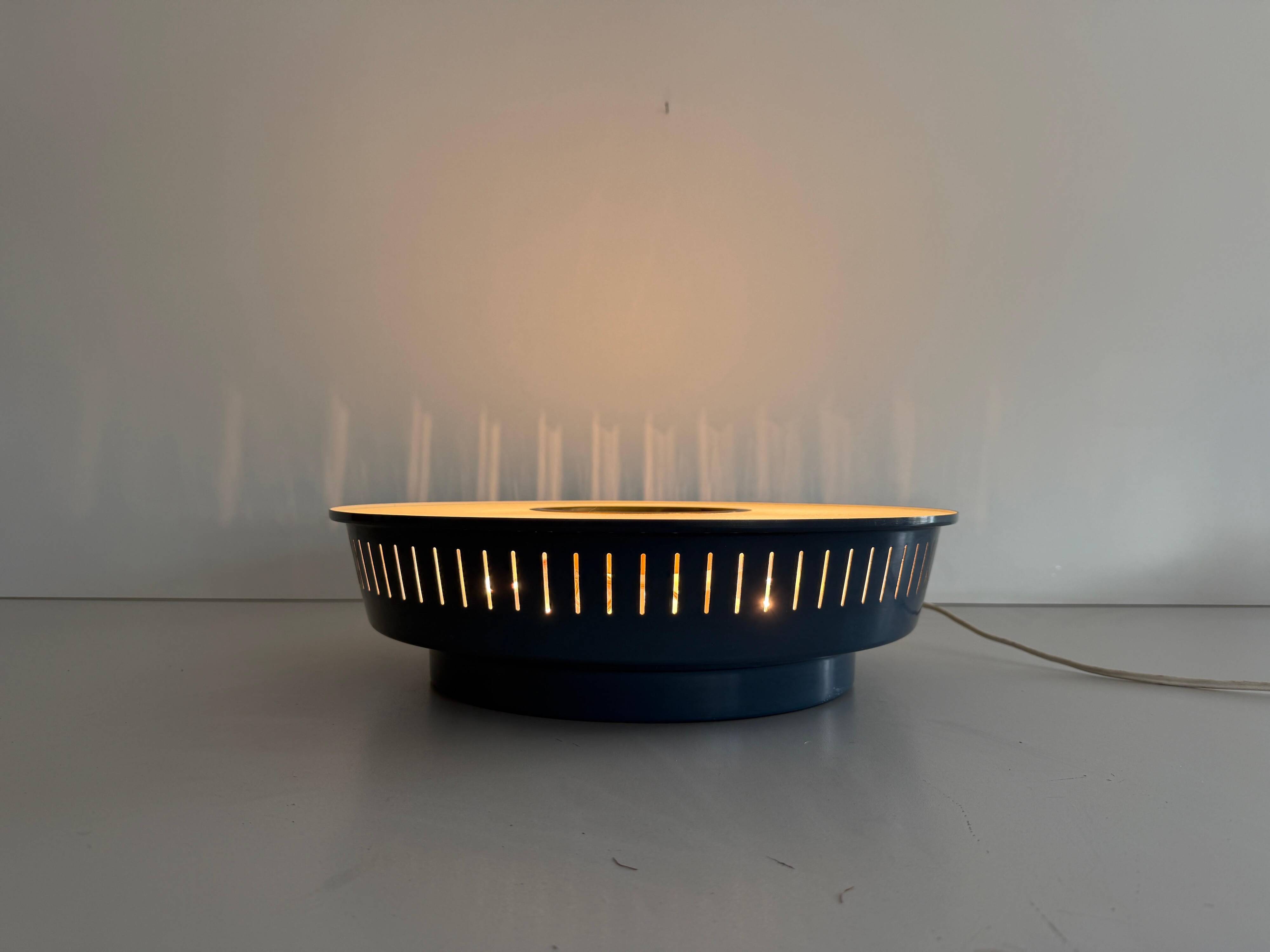 Flush-mounted metal frame with dark blue glass, Attributed to Stilnovo, 1950s, Italy.