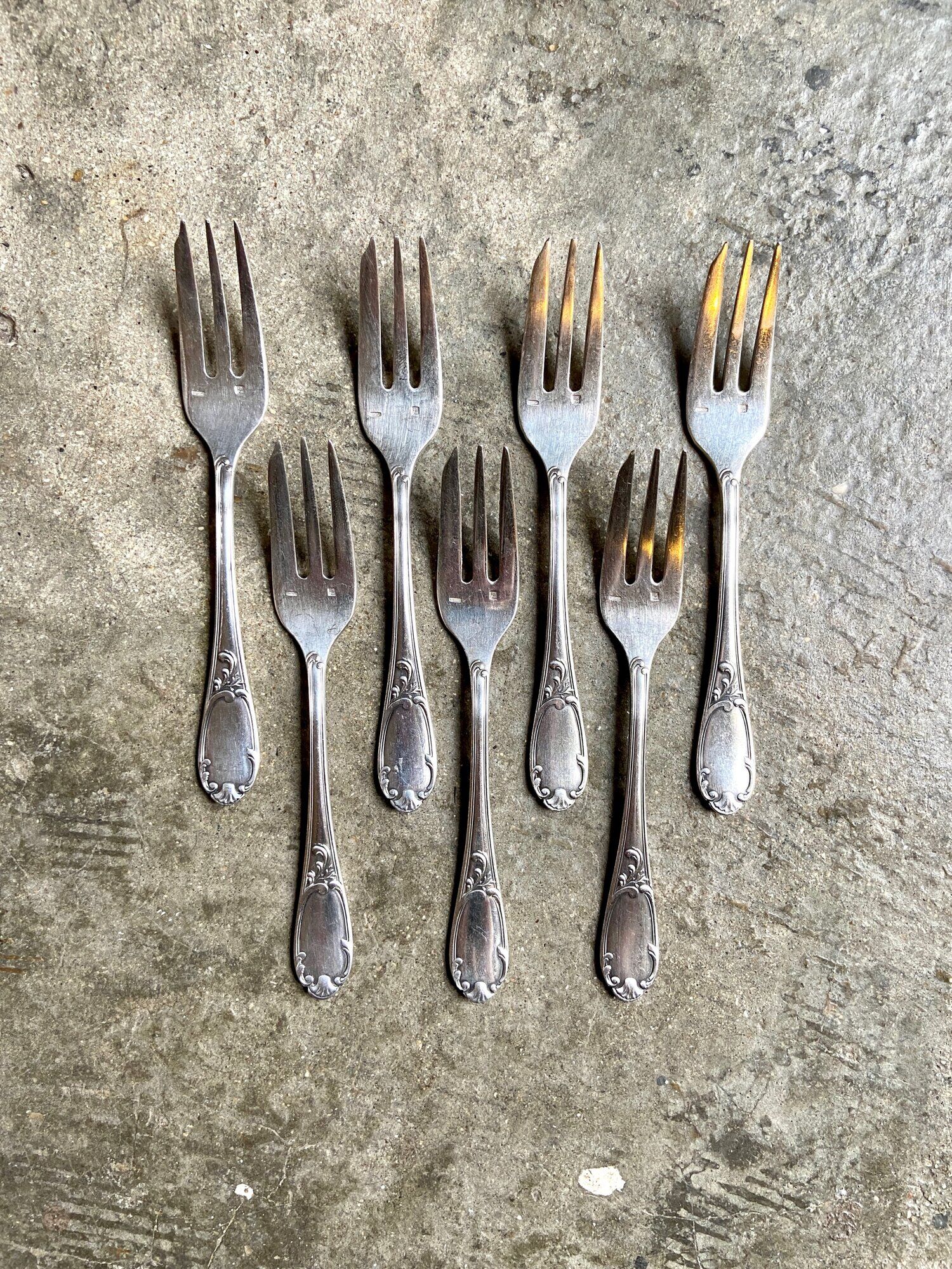 7 silver metal dessert forks