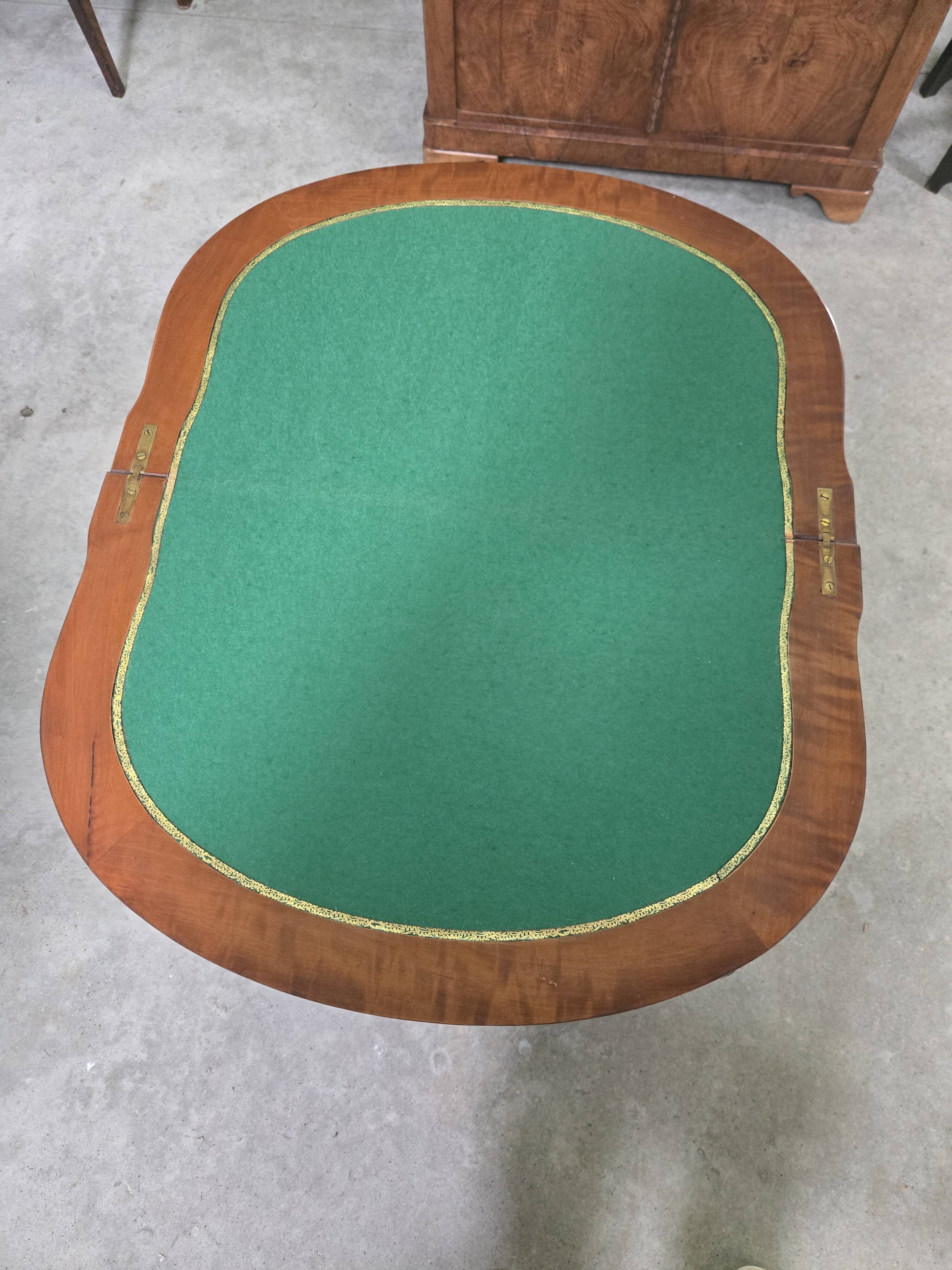 Half-moon gaming table in Louis XV style, made of precious wood marquetry.