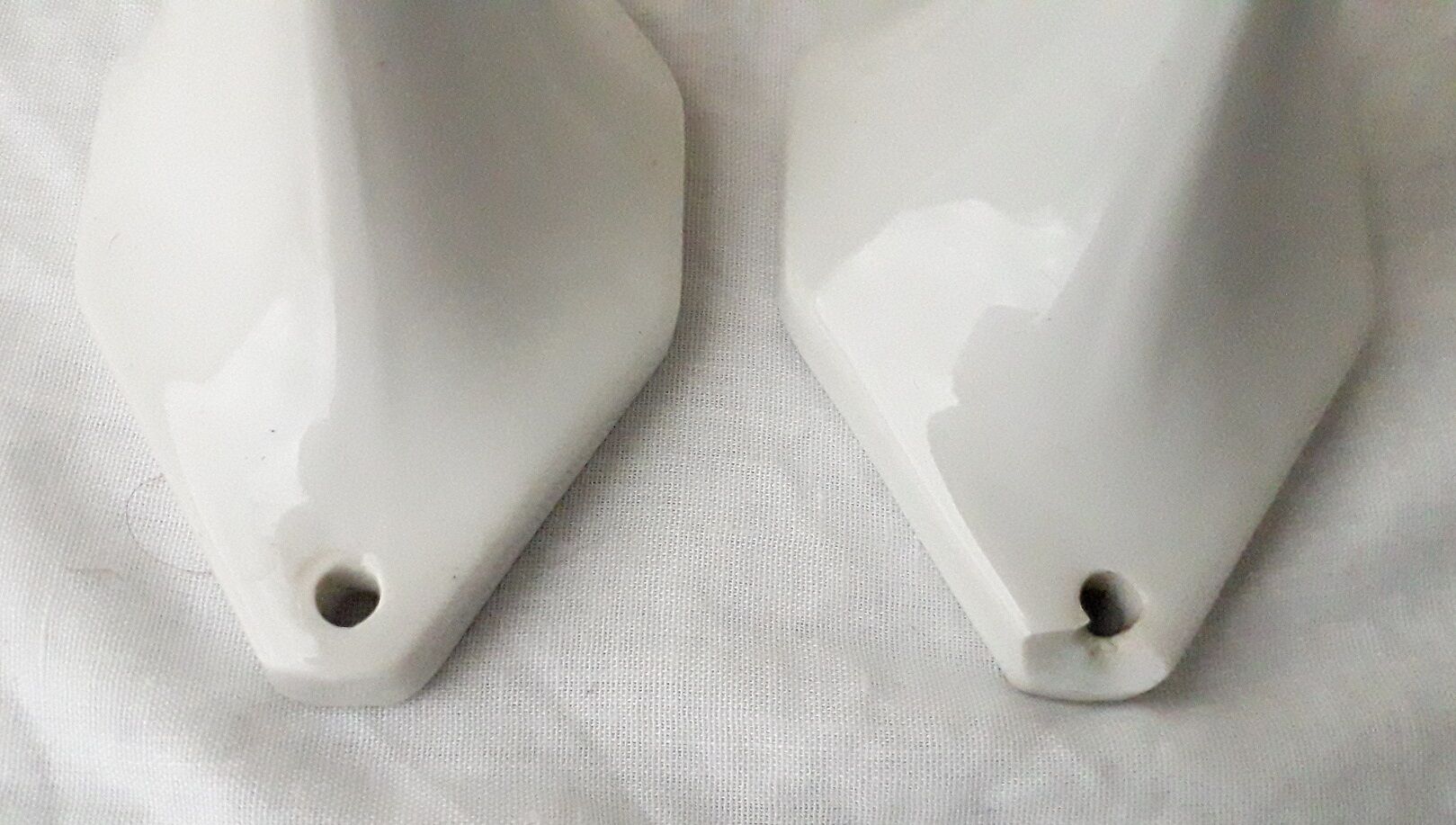 Pair of porcelain hooks