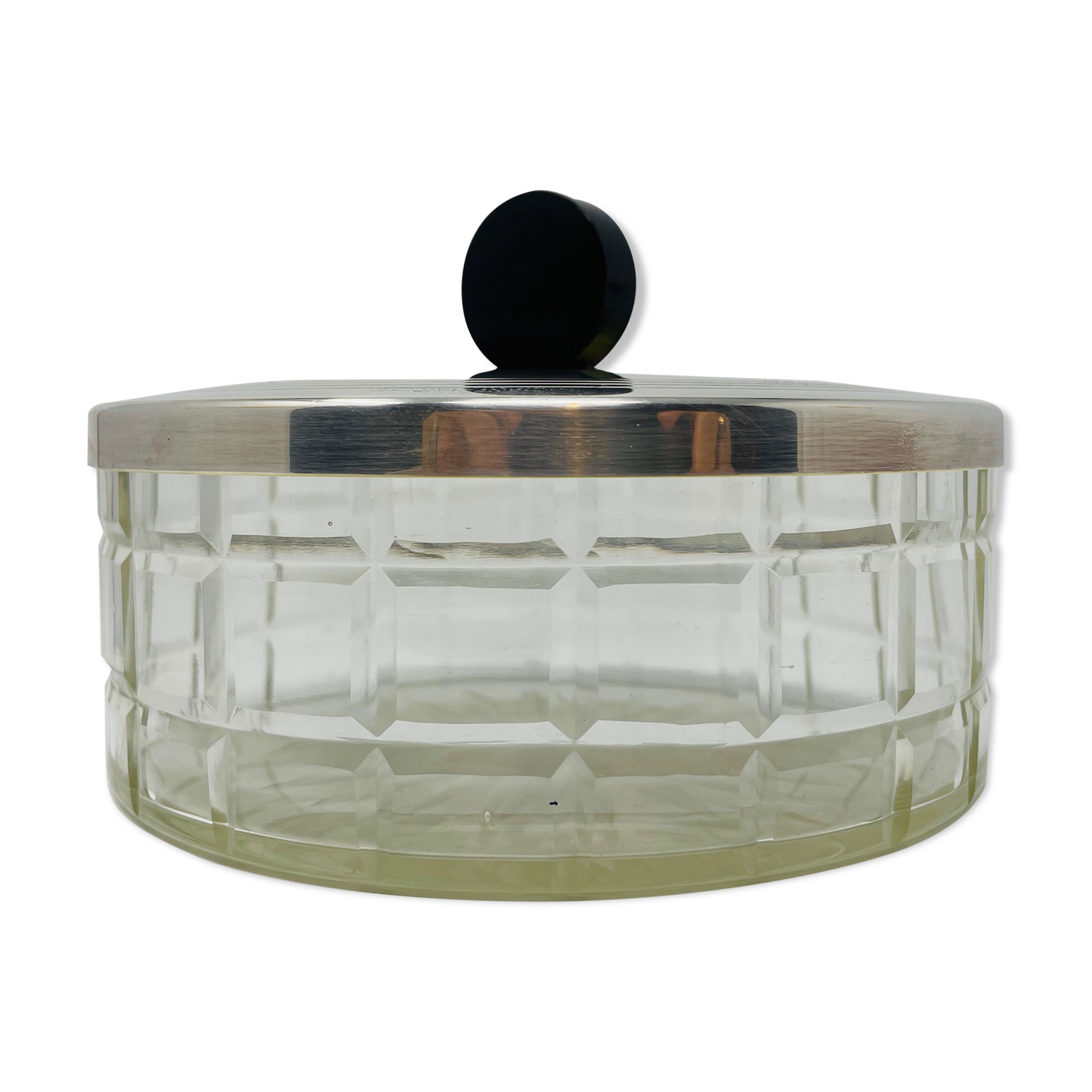 Vintage box made of chiseled glass and covered metal, taken in black Bakelite